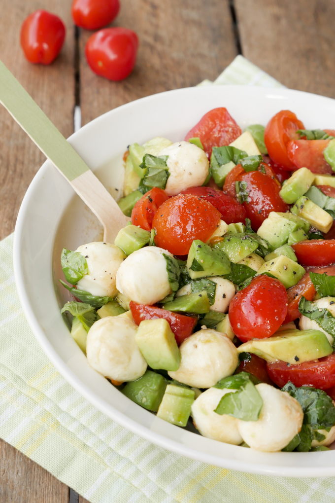 Quick Caprese Salad with avocado, tomatoes, mozzarella and basil 